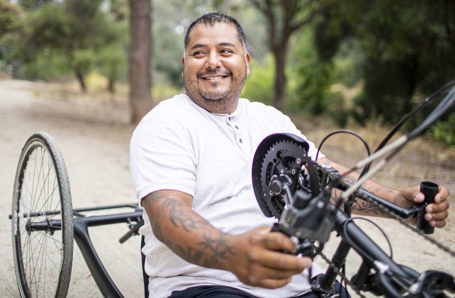 man smiling on bicycle